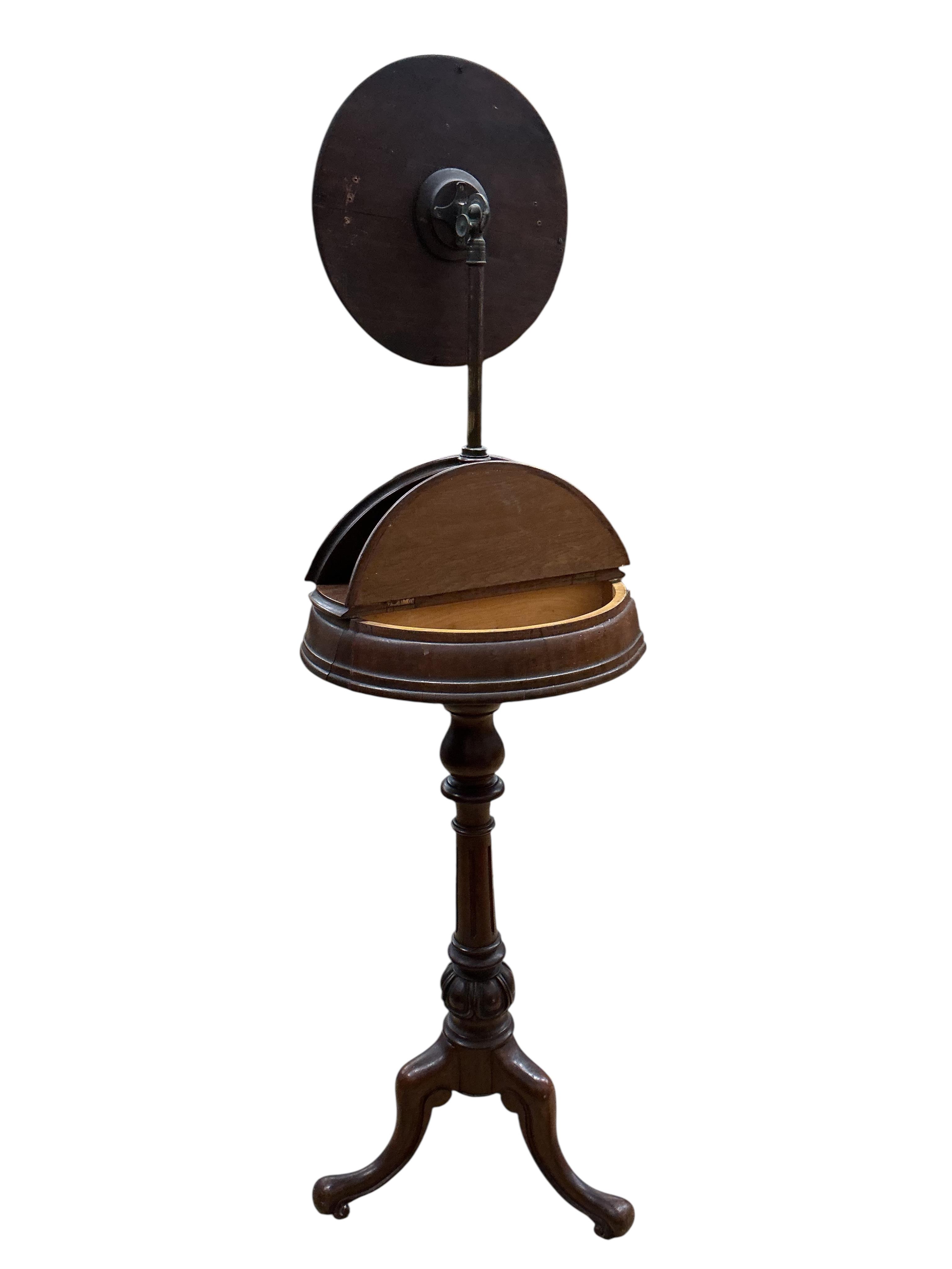 A Victorian mahogany shaving stand, with circular mirror and mid tier compartments, height 153cm